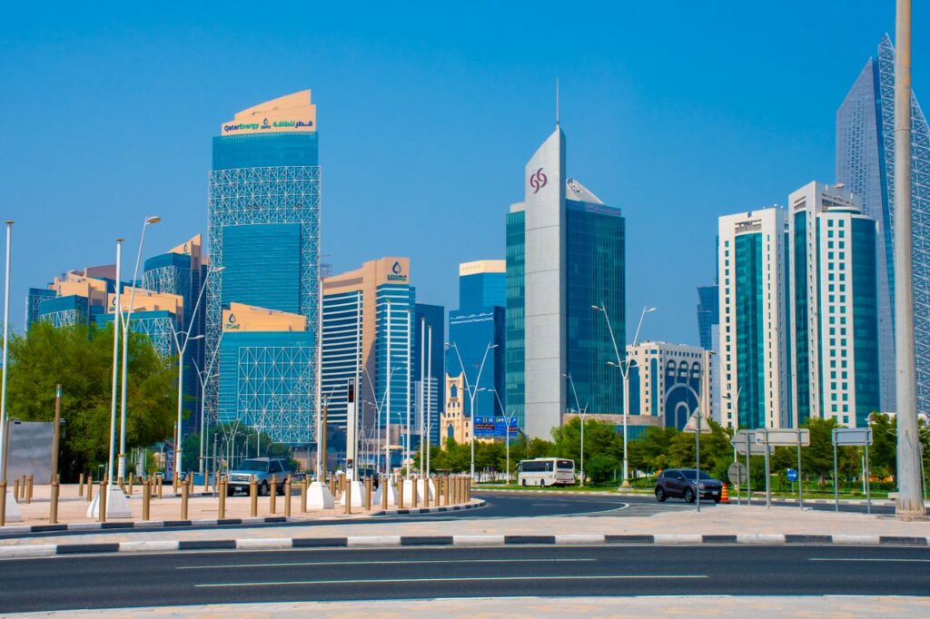 Capture of Doha's towering skyline featuring modern architecture and clear blue skies.